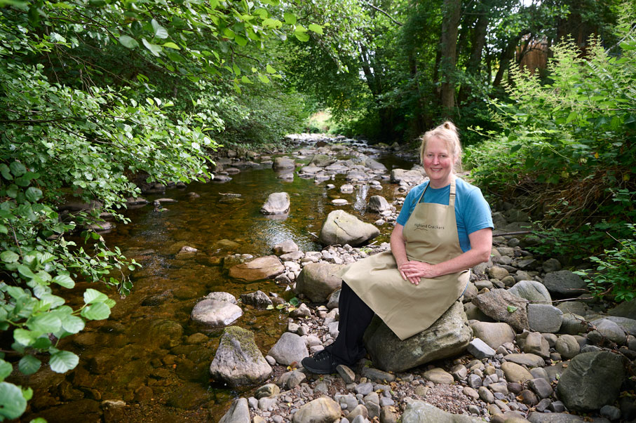 Donna Peacock beside a river 