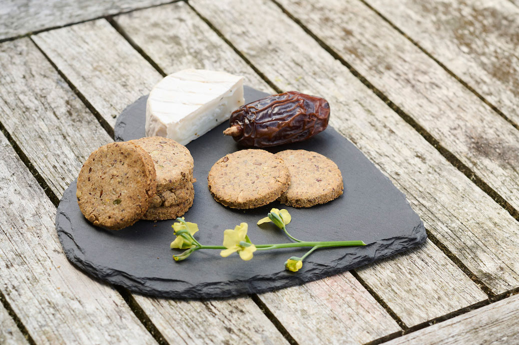 Crackers on a slate with cheese 