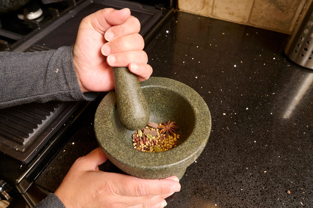 Spices being ground in a pestle and mortar