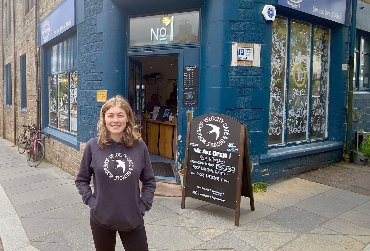 Isabel standing in front of Velocity cafe in inverness