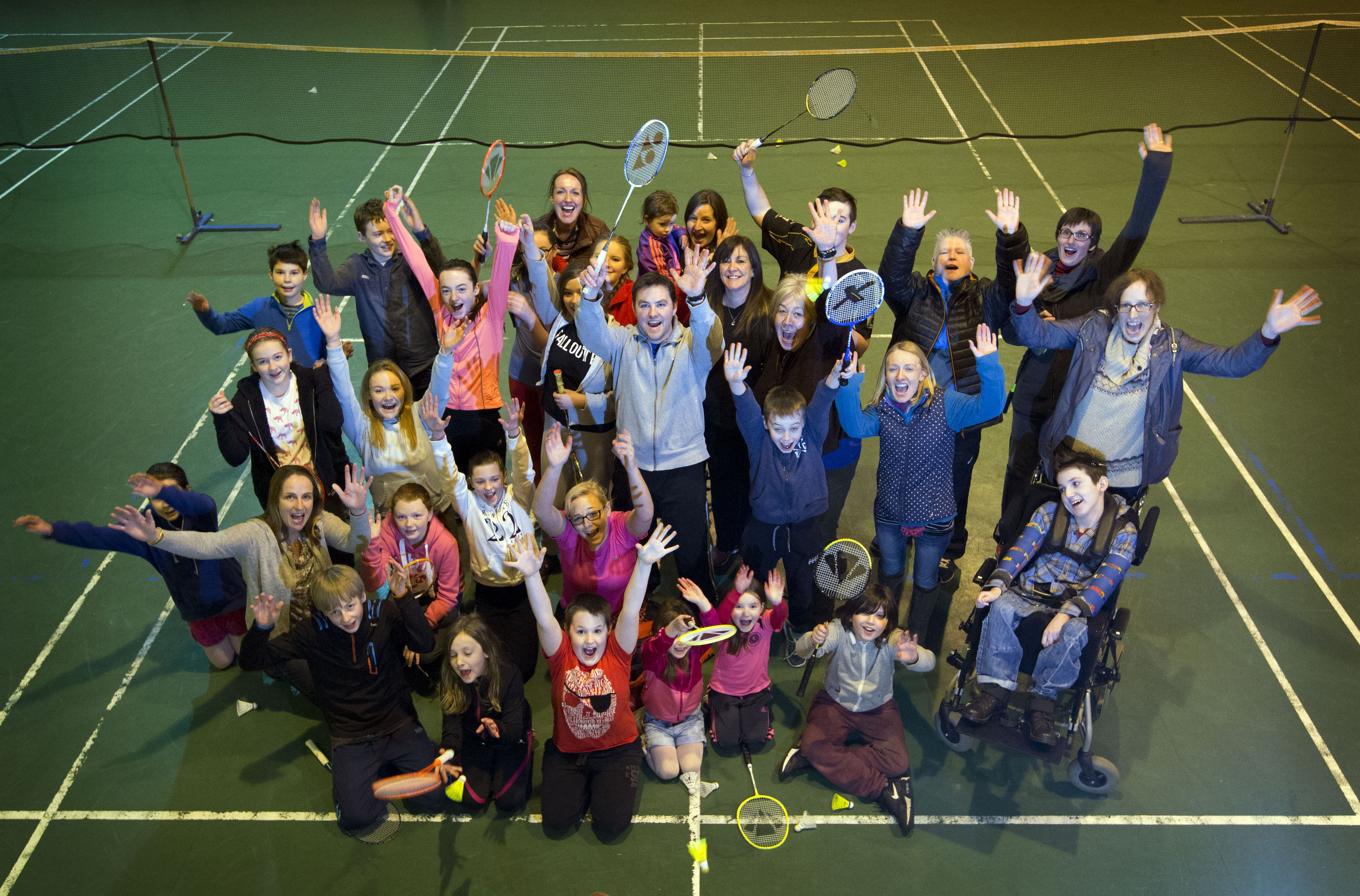 Large group of people on badminton court